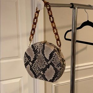 Round snake skin purse